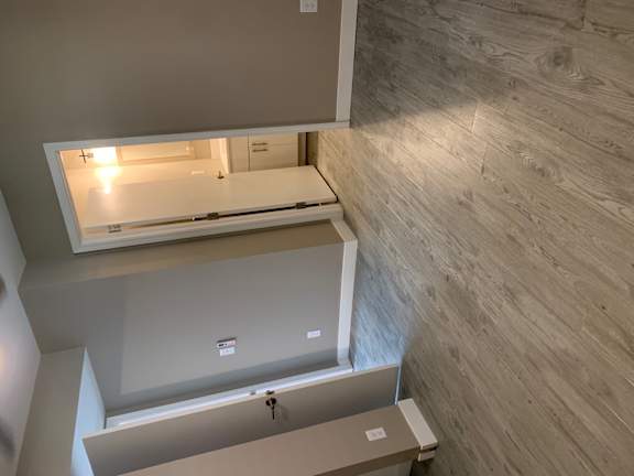 an overhead view of a kitchen with open drawers