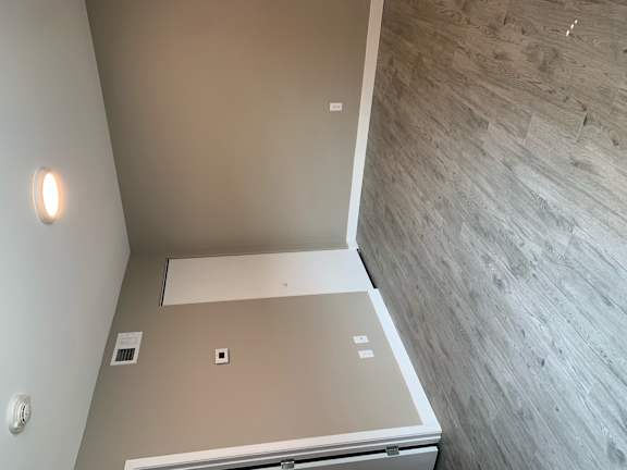 an overhead view of an empty room with a false ceiling