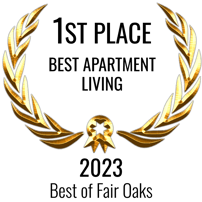 A golden laurel wreath with a central emblem.
