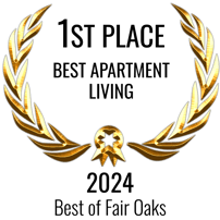 A golden laurel wreath with a central emblem.