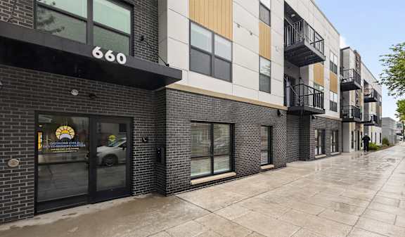 A street view of a building with the number 660 on it.