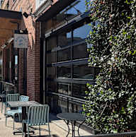 A sign that says "Adagio" hangs above a doorway.
