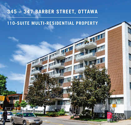an image of a apartment building in ottawa with a blue sky in the background