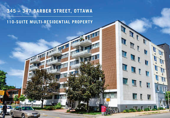 an image of a apartment building in ottawa with a blue sky in the background