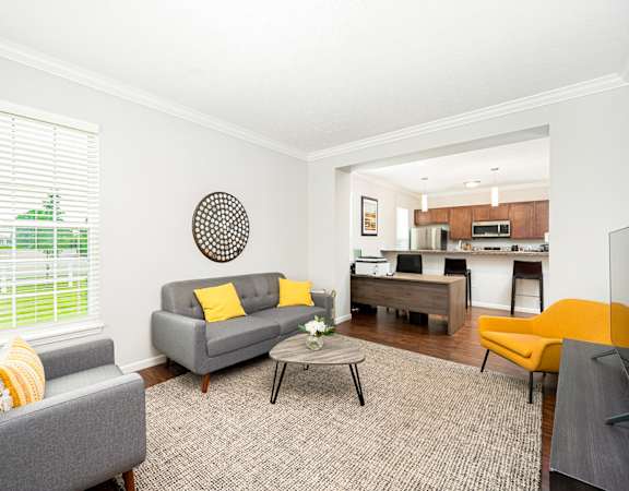 a living room with couches and a table