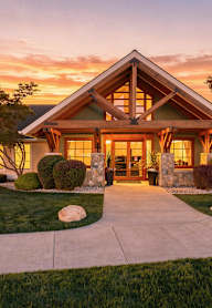 A house with a front yard and a driveway.