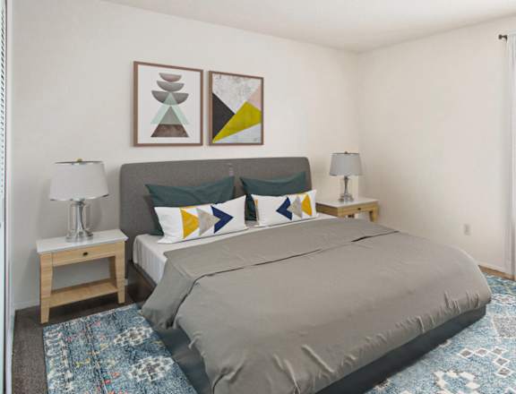 A bedroom with a large bed and a chair at Madeira Apartments, Kalamazoo, MI, 49001