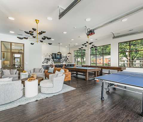 a games room with a ping pong table and a foosball table