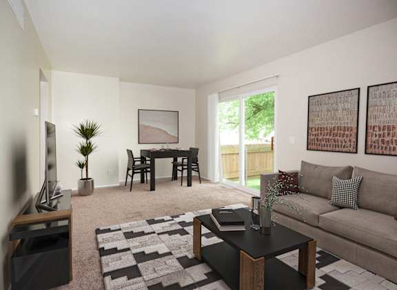 a living room with a couch and a table and a tv