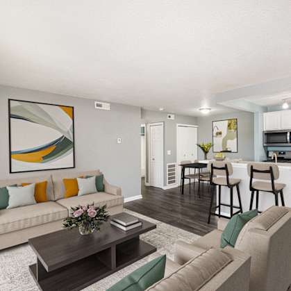 the living room of an apartment with a couch and a table