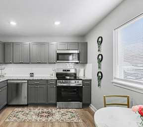 Kitchen with Stainless Steel Appliances at Mayfair Apartments, Missouri