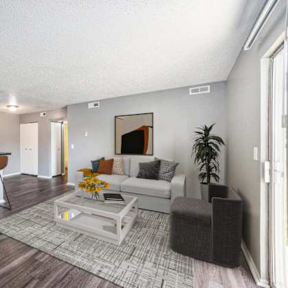 our apartments offer a living room with a couch and a table