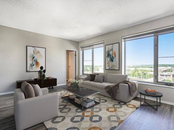 an empty living room with three large windows
