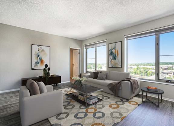 an open living room with couches and a coffee table