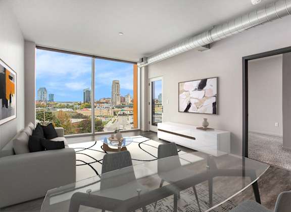 an open living room with a view of the city