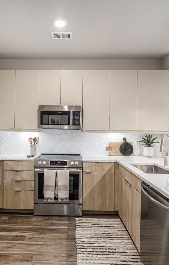 a rendering of a kitchen and living room in an apartment