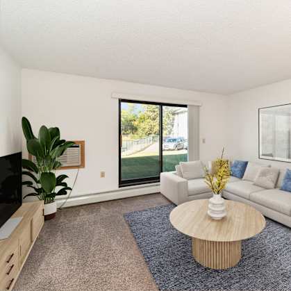 a living room with a couch and a coffee table. Hutchinson, MN Deer Park Apartments