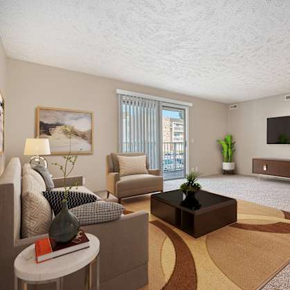 a living room with a couch and a coffee table and a television