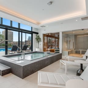 a spa area with a jacuzzi and a pool in a luxury apartment at Cassidy on Canal, Chicago, Illinois, 60654