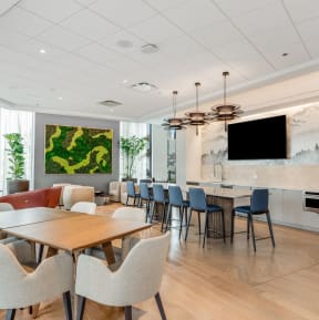 a dining room with tables and chairs and a tv at Cassidy on Canal, Chicago, Illinois, 60654