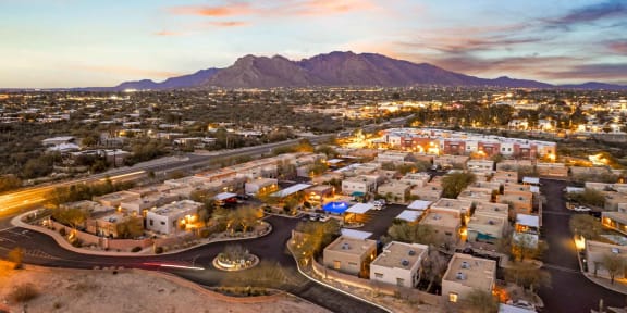 an aerial view of the city at sunset