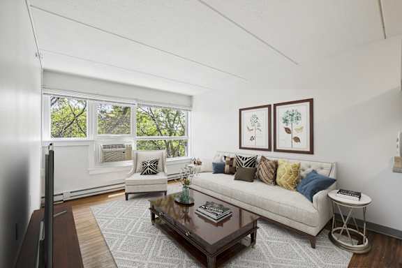 a living room with a couch and a coffee table at Baystate Place, Springfield, 01104