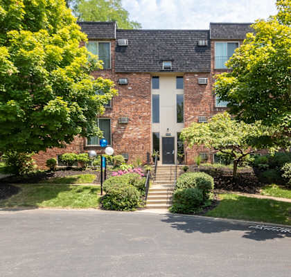 This is a photo of building exteriors at Romaine Court Apartments in the Oakley neighborhood of Cincinnati, Ohio.