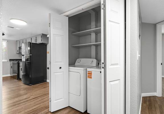 White laundry room at Redwood Cove Apartments, Chico, CA 95928