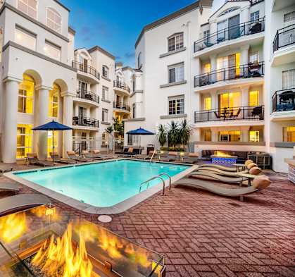 Swimming Pool With Lounge Chairs at The Preston Miracle Mile Apartments, Los Angeles, 90036