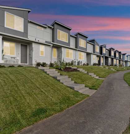 Apartments with a sidewalk in front of it at Thrive at Green Mountain, Camas, WA, Washington