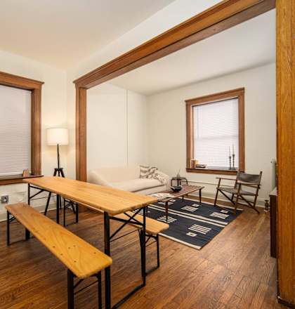 a living room with a dining table and a couch