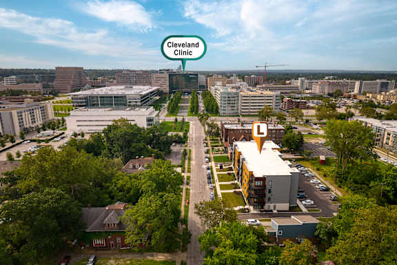 An aerial view of the city with a building labeled Cleveland Clinic. at The Lumos Apartments in Cleveland, OH