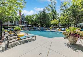 a swimming pool with a house in the background at Lakeside on Riverwatch in Martinez, GA 30907
