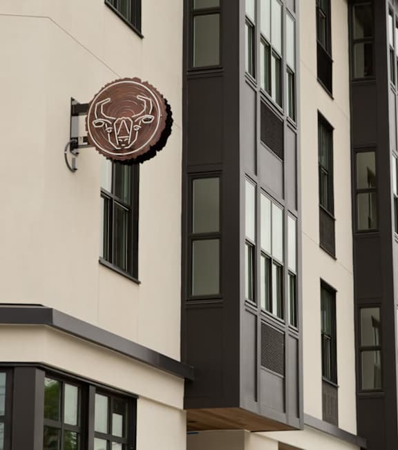 A brightly lit Portland sign is seen at night.