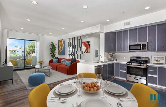 a bedroom with a bed and two blue stools