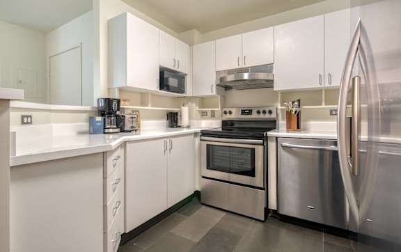Modern Kitchen with refrigerator at Grand Central Market Apartments, Los Angeles, CA, 90013