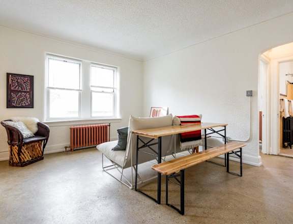 a living room with a couch and a table