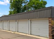 Thumbnail 7 of 20 - a row of garage doors on the side of a building