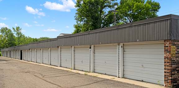 a row of garage doors on the side of a building