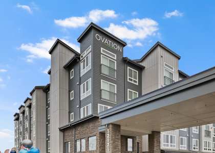 A modern building with the word "Ovation" on it.