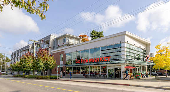 a large building on the corner of a street