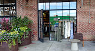 A storefront with a glass door and a sign that reads "The Pink Six".