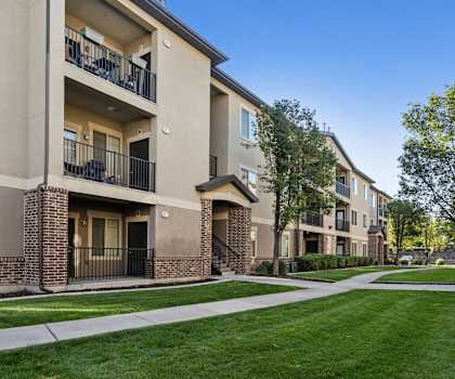 our apartments have a spacious courtyard with green grass and trees