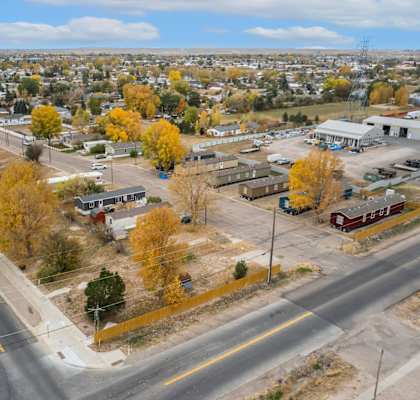 an aerial view of a city with a highway and trees at Country Lane, Cheyenne, Wyoming