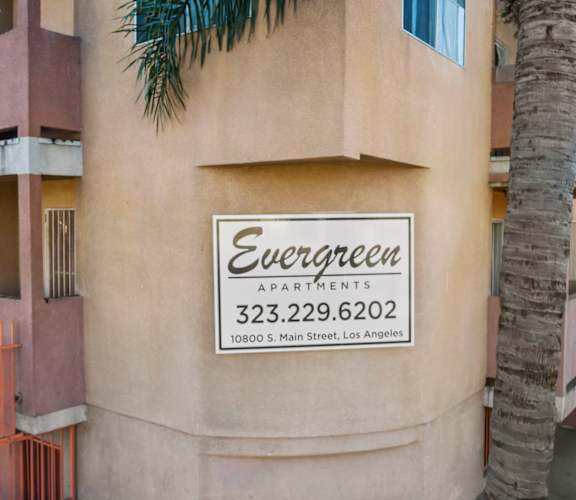 The building is called Evergreen Apartments.