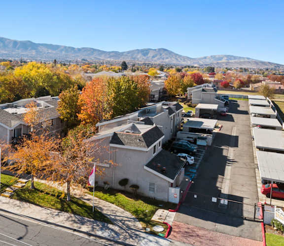 A view of a residential area with houses and trees.