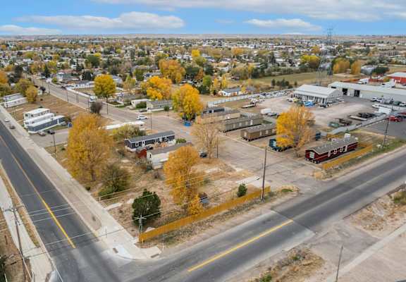 an aerial view of a city with a highway and trees at Country Lane, Cheyenne, Wyoming