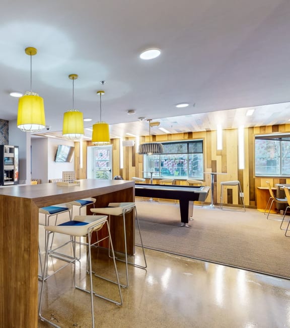 a clubhouse with a bar and a pool table, Student Housing in Minneapolis