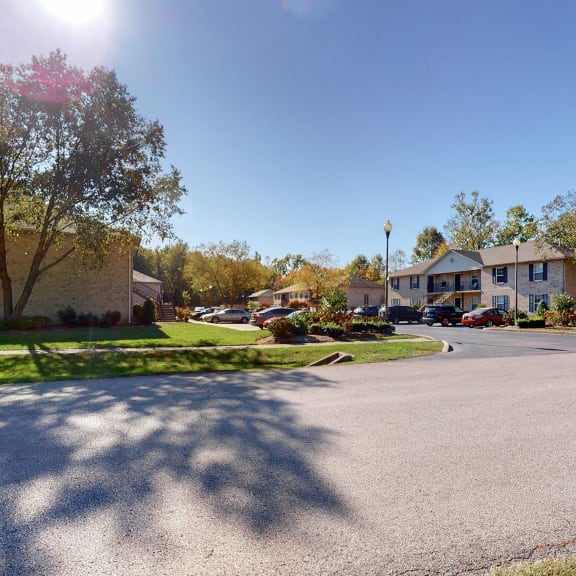 a street in a neighborhood with houses and trees