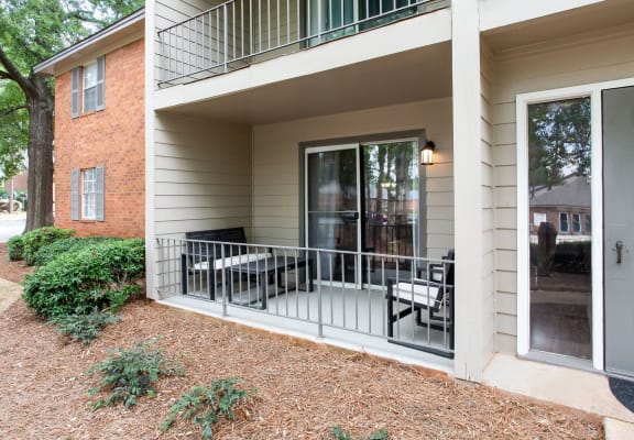 Exterior of Pinewood at National Hills Apartments, brick building with green landscaping